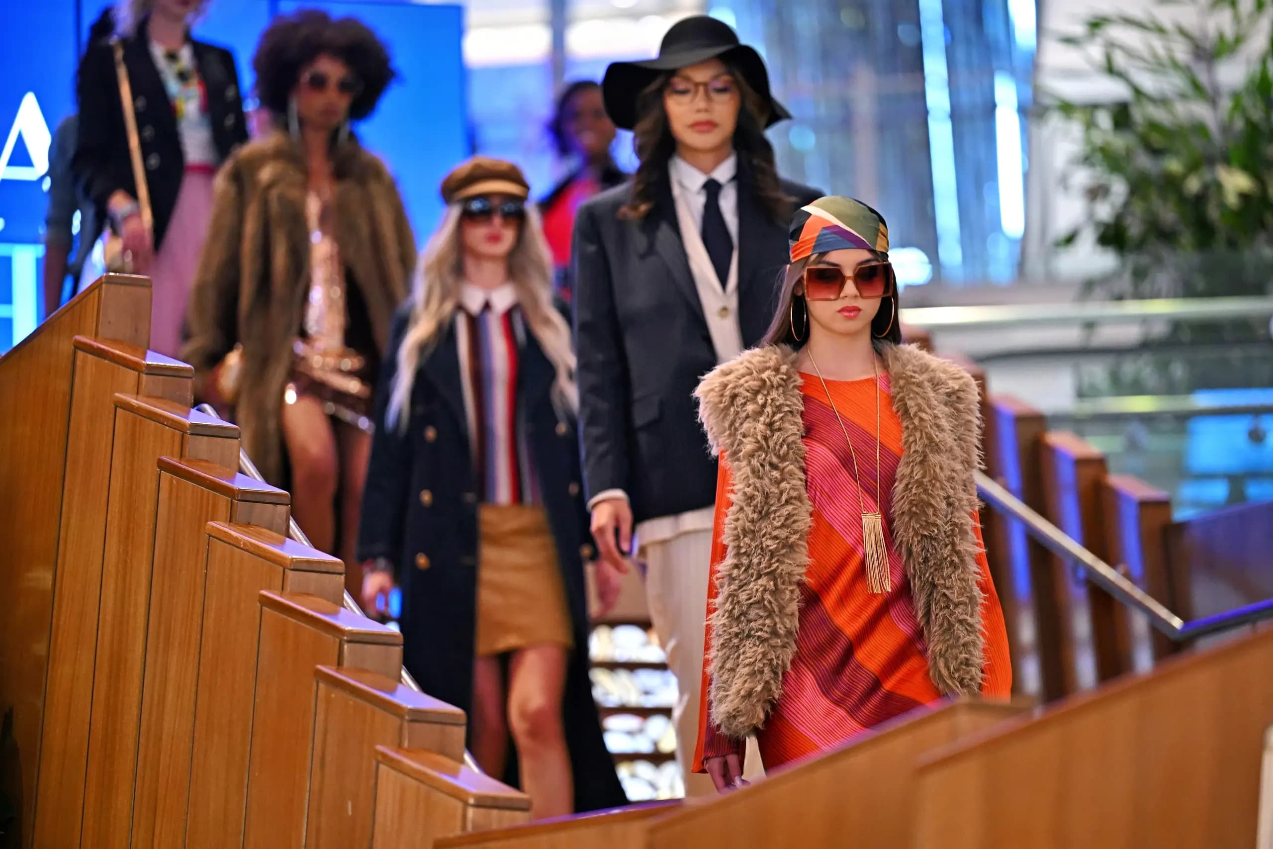 Models come down a staircase during a Vegas Fashion Week® runway show