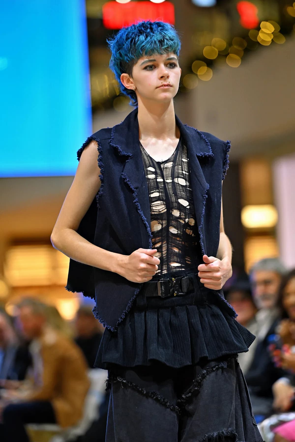 A model presents a student designer's look on the runway at the Vegas Fashion Week® student show