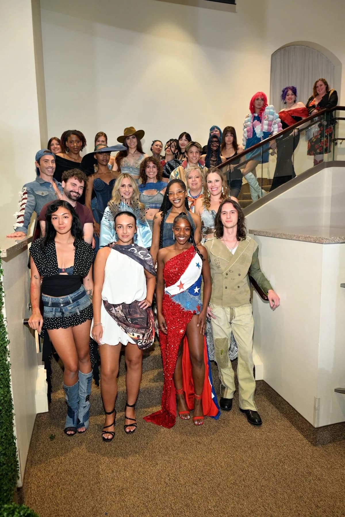 Designers and models together on a staircase at Eco Couture Vegas 2026